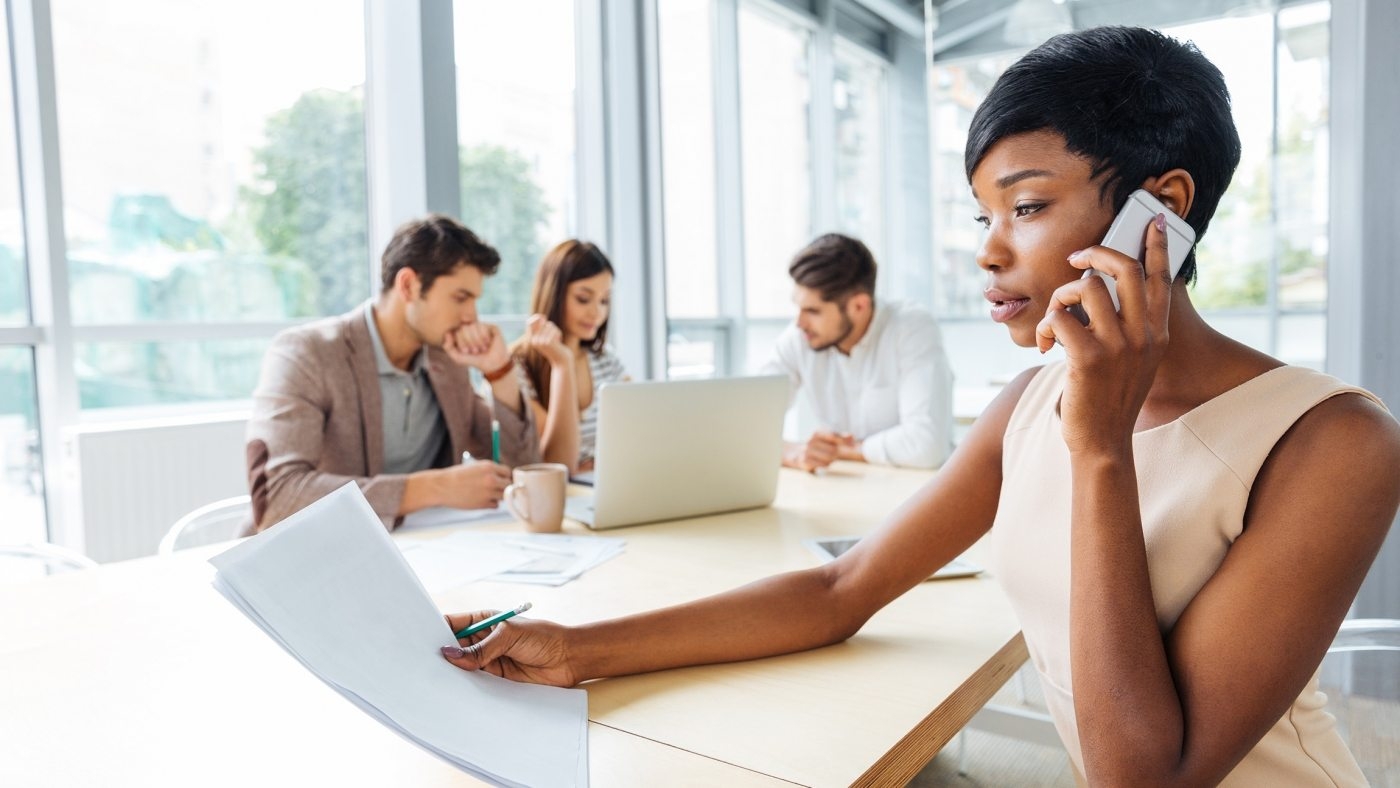 serious-businesswoman-with-documents-talking-on-P9Q6LX6-1400x788