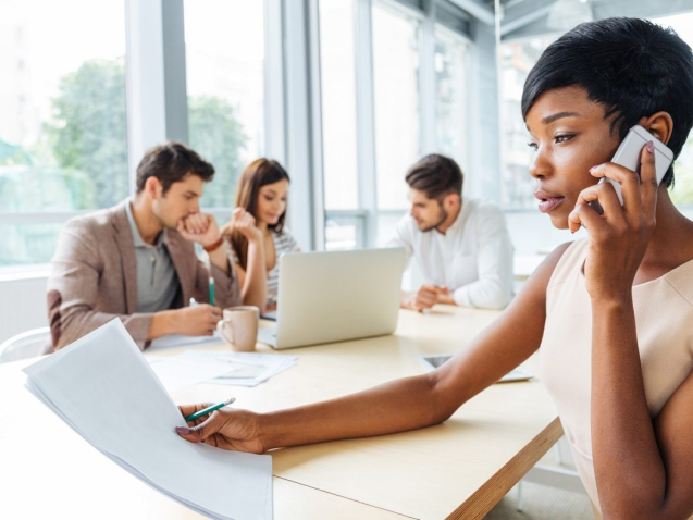 serious-businesswoman-with-documents-talking-on-P9Q6LX6-1400x788